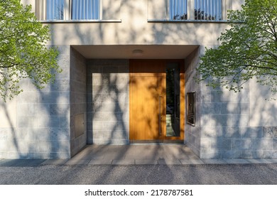 View To Entrance Door Of A Modern Residential Building With New Apartments In The City