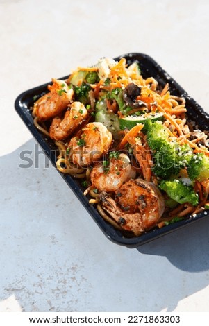 A view of an entree of shrimp chow mein.
