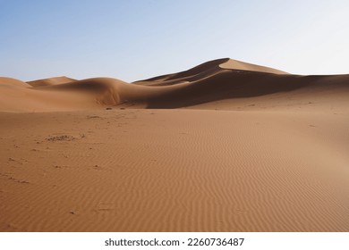 View to Erg Chigaga dune on Sahara desert in african southeastern MOROCCO, clear blue sky in 2023 warm sunny winter day on January. - Powered by Shutterstock