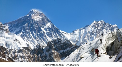 view of Everest and Lhotse from Gokyo valley with group of climbers on glacier, way to Everest base camp, Sagarmatha national park, Khumbu valley, Nepalese Himalayas