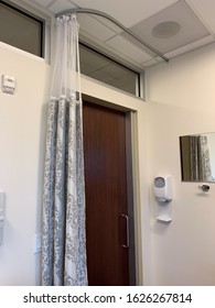 View Of An Exam Room Entrance. Door And Privacy Curtain. Hospital Room.