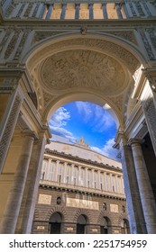 View of exterior of Royal Theatre of Saint Charles from the entrance to the Galleria Umberto I in Naples, Italy. The inscription 