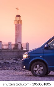 View To Facade Of Blue Minibus And Lighthouse