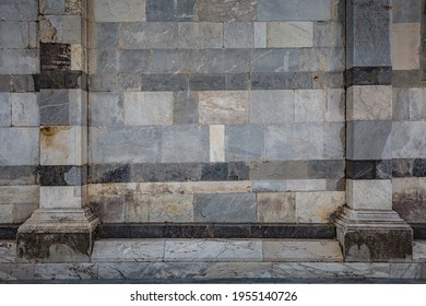 View of facade detail - wall of Primatial Metropolitan Cathedral of the Assumption of Mary in Piazza del Duomo in Pisa