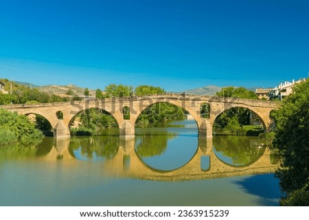 View of the famous bridge over the Arga River in Puente la Reina, Navarra. This historic building and the village are important landmarks on the Camino de Santiago