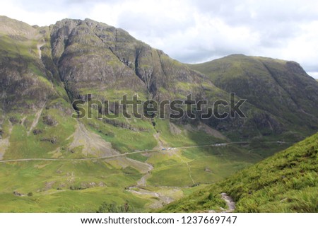 The A82 road as it passes through the Glencoe Mountains in Ballachullish, Scottish Highlands
