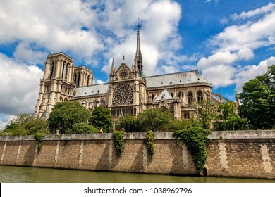View of famous Notre-Dame de Paris Cathedral under beautiful sky in Paris, France.