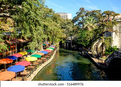 View Of The Famous River Walk In San Antonio, Texas. The Riverwalk Is A Popular Destination For Tourists And Locals. Sightseeing Tours Are Offered By Boats That Ply The River Day And Night.