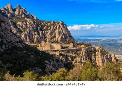 View of the famous Santa Maria de Montserrat Abbey located on the mountain of Montserrat nearby from Barcelona in Catalonia, Spain. Montserrat Monastery - Powered by Shutterstock