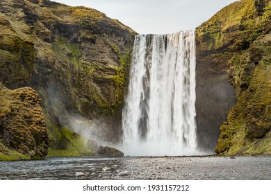 View of famous Skógafoss waterfall with nobody around on a sunny spring day. Skoga river, highlands of Iceland, Europe. Popular Travel destinations. Amazing nature, classic Icelandic Landscape