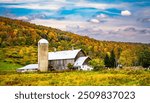 View of farm with barn and Silo in the finger lakes region of Upper New York near Watkins Glen