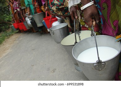 View of farmers are depositing their cows milk to the sales center. - Shutterstock ID 699531898