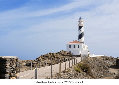 View of Favaritx lighthouse on Menorca island, Spain. Balearic Islands, Popular tourist attraction and travel destination in Europe