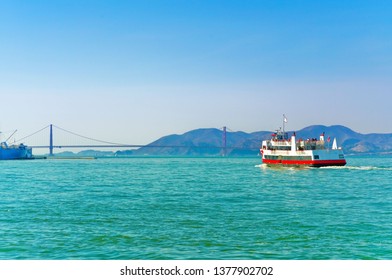 View of a ferry running on San Francisco Bay with Golden Gate Bridge in the background in San Francisco. - Powered by Shutterstock