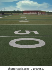 The View From The Fifty Yard Line On An Astroturf Football Field.