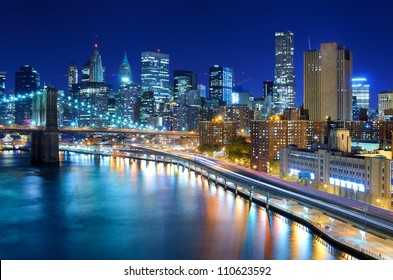 View Of The Financial District Of Manhattan At Night In New York City.