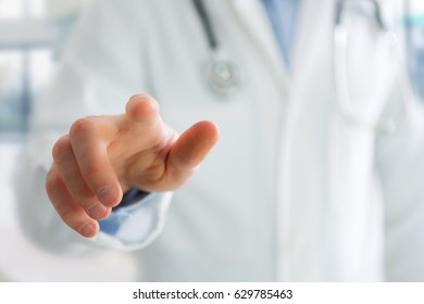 View of a Finger of a doctor holding at you