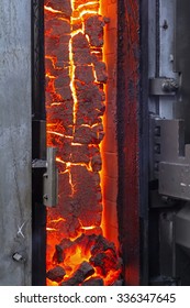 View of the finished coke into the open door of the coke oven
