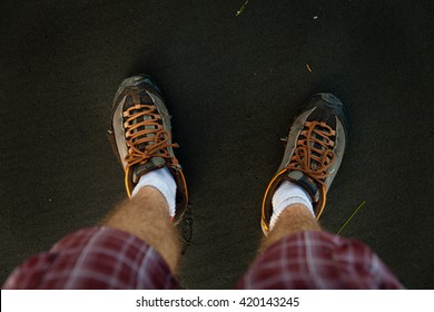 View First Person Perspective Man Legs On The Black Volcanic Sand / Man Feet On Beach Sand 