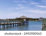 View of fishing dock along the shoreline on Ocracoke Island, in Outer Banks, North Carolina, USA