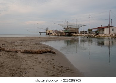 View of fishing huts on shores of estuary near Comacchio valley, Ravenna,Italy - Shutterstock ID 2226289905