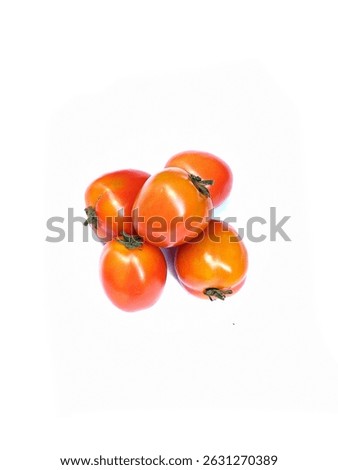 A bird’s-eye view of five tomatoes on a clean white surface