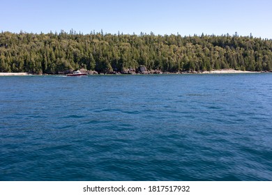 View Of Flowerpot Island Shore From A Tourist Boat.