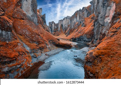 View from flying drone of Fjadrargljufur canyon and river. Colorful autumn scene of South east Iceland, Europe. Beauty of nature concept background. - Powered by Shutterstock