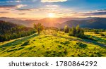 View from flying drone of mountain valley with old country road. Fabulous summer scene of Carpathian mountains, Dzembronya village location, Ukraine, Europe. Beauty of nature concept background.
