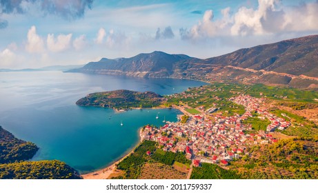View from flying drone of Palaia Epidavros, small town in the Argolis prefecture of Peloponnese, Greece. Spectacular summer seascape of Mediterranean sea. Traveling concept background.
