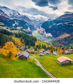 View from flying drone of Wengen village, district of Lauterbrunnen. Awesome morning scene of Swiss Alps. Aerial autumn landscape of Switzerland countryside, Europe. Traveling concept background.