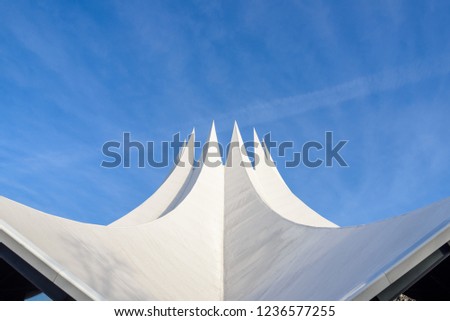View of fold thin concrete shell roof structure looks like crown.Futuristic geometric roof detail and advance roof concrete technique.