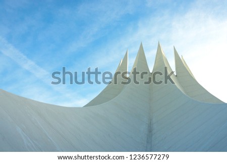 View of fold thin concrete shell roof structure looks like crown.Futuristic geometric roof detail and advance roof concrete technique.