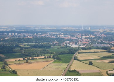 The view form inside the window of an airplane while approaching for landing at the airport of Munich, Germany. View from the airplane on Munich