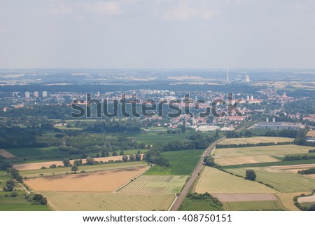 The view form inside the window of an airplane while approaching for landing at the airport of Munich, Germany. View from the airplane on Munich