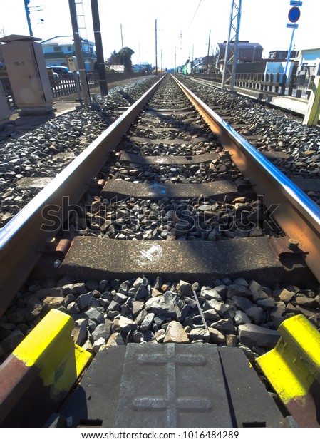 A view form a railroad crossing to the inbound of\
Tobu Utsunomiya line at Omochanomachi, Mibu, Tochigi, Japan in\
January, 2018.
