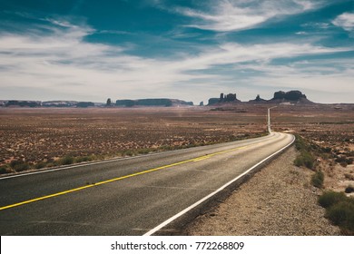 View From The Forrest Gump Point Of The Bright And Shiny Highway 163 Running To The Buttes (saddlerock And Stagecoach) Of The The Monument Valley Navajo Tribal Park On A Sunny Day Of Summer, Utah.