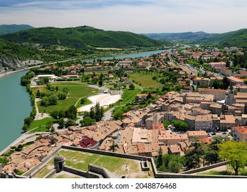 View From The Fortress Of Sisteron To The Green Shimmering River Durance And The Old Town Of Sisteron France On A Beautiful Spring Day With A Few Clouds In The Sky