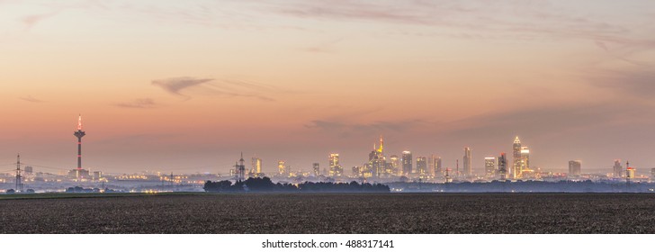 View Of Frankfurt Skyline With Fields By Night