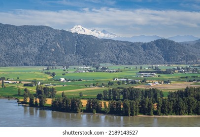 View of the Fraser Valley near Abbotsford BC. Summer in the Fraser Valley. Canadian homestead. Rural agricultural land. The Frazier River is an important salmon habitat for the lower mainland of BC - Shutterstock ID 2189143527