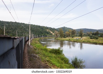 View from a freight train while trainhopping along a river in Russia