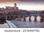 View of French episcopal city of Albi with Cathedral Basilica of Saint Cecilia and Pont Vieux over river Tarn
