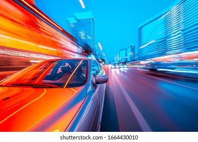 View from Front of Car moving in a night city, Blured road with lights with car on high speed.