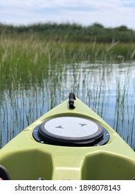 View Of Front Of Kayak In Green Salt Marsh