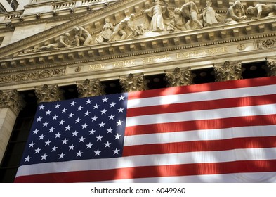 View Of Front Of New York Stock Exchange Bathed In Golden Sunlight.