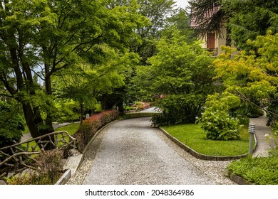 View Of A Front Yard Of A Traditional Old House In Como Lake