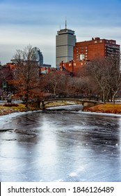 View of frozen Charles River from a Dock by Hatch Memorial Shell in winter, blue sky, Cloudy day, Boston Massachusetts,USA.