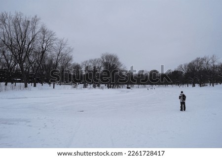 View of the frozen pond at Parc La Fontaine in Montreal, Quebec in winter