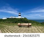 View of Fugui Cape Lighthouse, Shimen (wooden sign written, Taiwan northernmost Fugui Cape Lighthouse), Taiwan - 26 August 2024 (sunny blue sky)