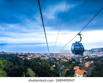 View of Funchal city cable car in capital of Madeira island in Portugal, situated among several mountains along the coast of Atlantic ocean. - Powered by Shutterstock